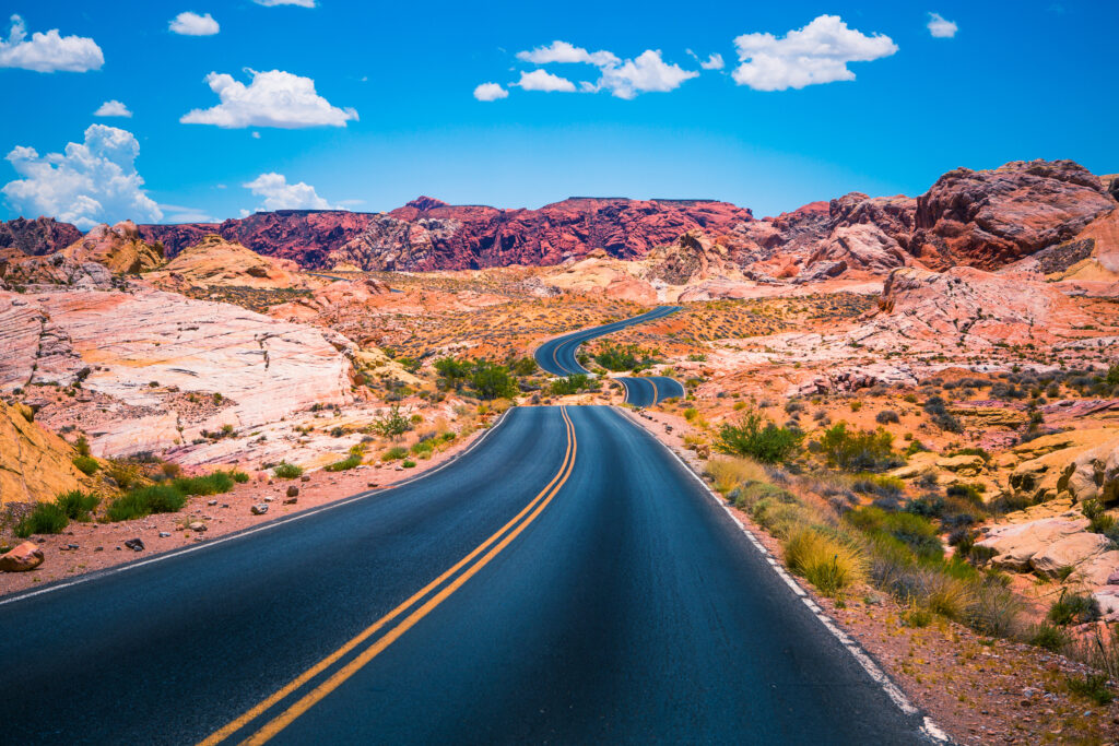 A scenic panoramic view of Valley of Fire Road, just a short drive from the vibrant communities of Las Vegas, Nevada.