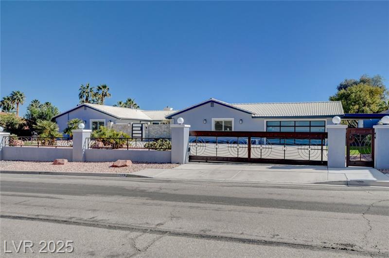 Single-Story Home on Acreage with Pool and Privacy Gates