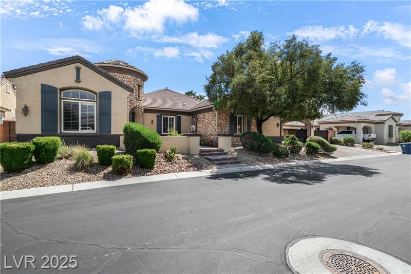 Exterior view of a beautifully upgraded home at 6524 Convinto Street in a gated community