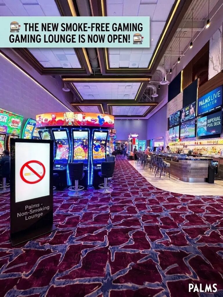 Vibrant interior of the Palms Casino Resort smoke-free lounge in Las Vegas, showing rows of slot machines and a craft bar. In the foreground, a prominent digital sign features a universal no-smoking symbol and text reading 'Palms - Non-Smoking Lounge.'